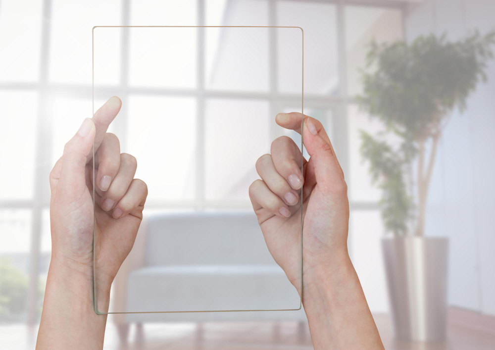 hands-holding-glass-screen-against-window
